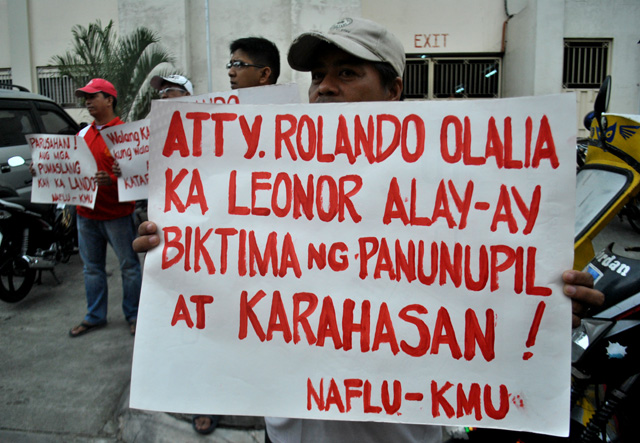 Ayon sa KMU, pinaslang ng RAM sina Olalia at Alay-ay para itulak ang gobyerno ni Corazon Aquino noong 1986 na tanggalin sa kanyang gabinete ang binansagan niyang mga "maka-kaliwang" opisyal. (Macky Macaspac)